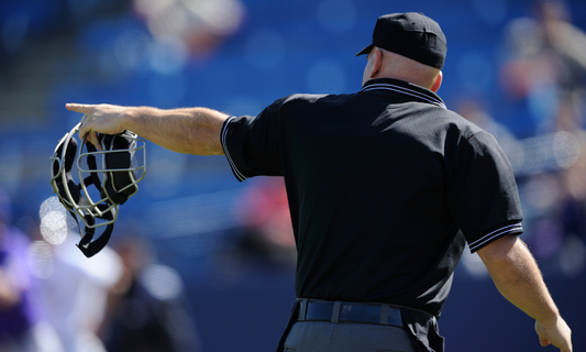 Baseball umpire pointing after ABS call
