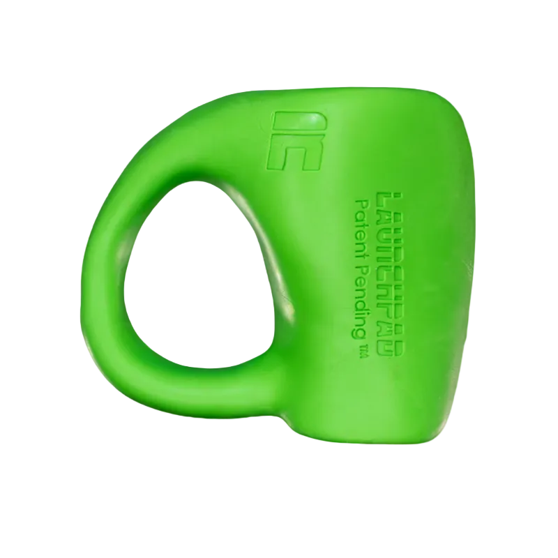 Green dog toy with 'Launchpad' branding on a white background