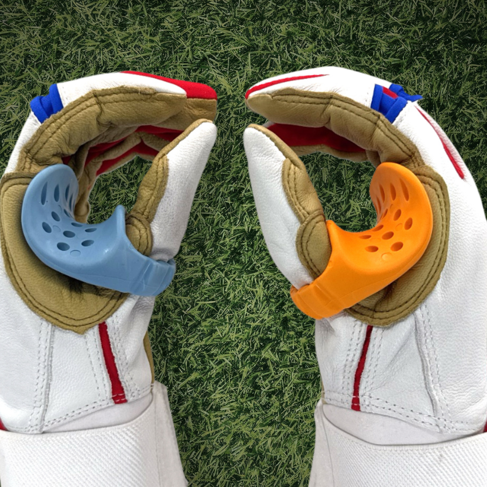 A left and right hand baseball thumb guard on hands with batting gloves