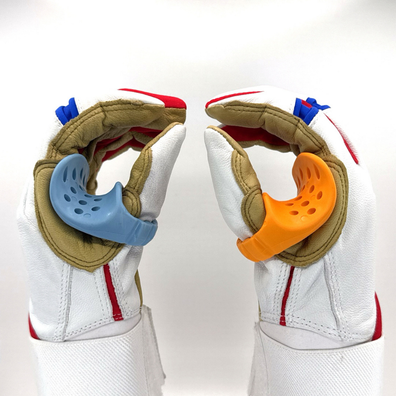 A left- and right-handed thumb guard on two hands with baseball gloves
